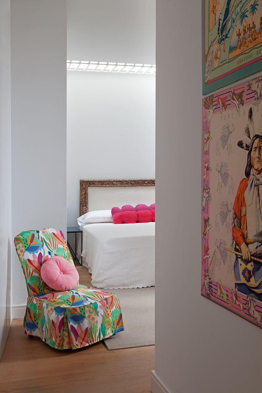 A multicolored slipper chair adds more punch to the room as you enter.