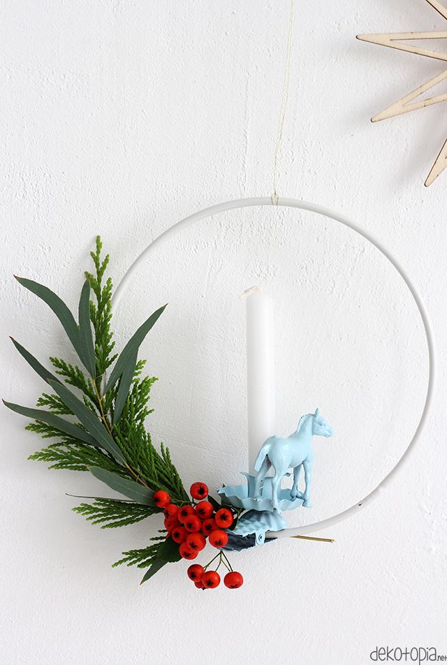 Asymmetrical wreath featuring a custom candle holder