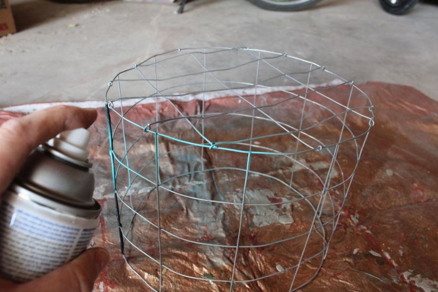 Set the wire cage on a drop cloth