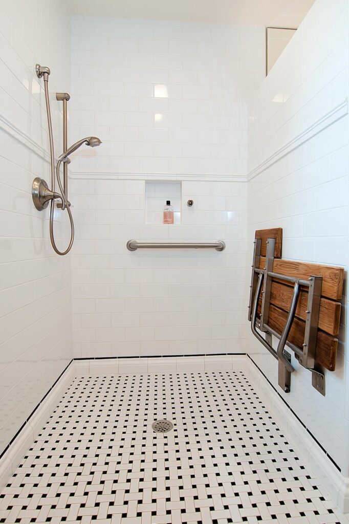 Shower Enclosure with a Fold-Down Seat