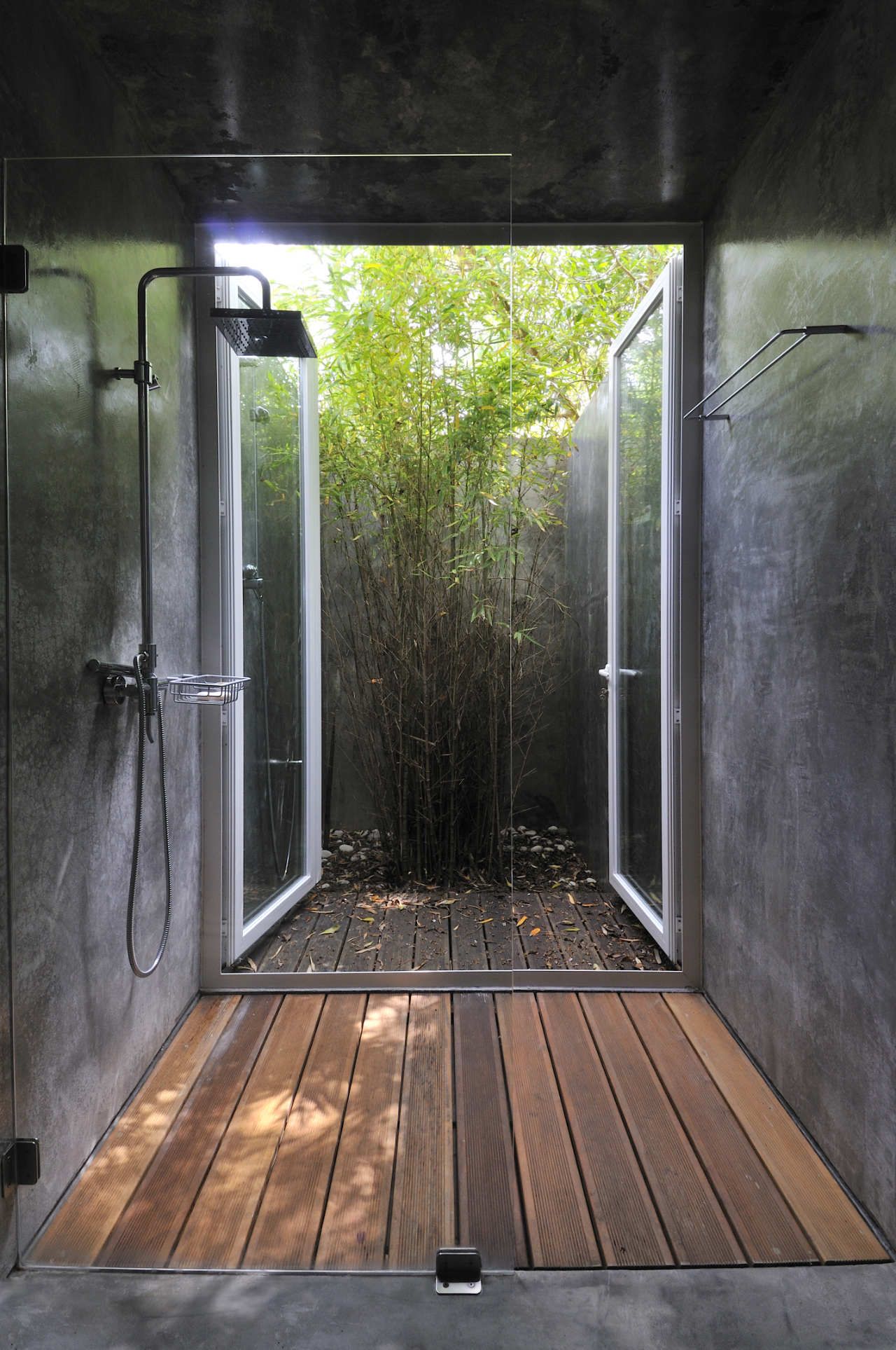 Shower with large doors to outdoor deck floor