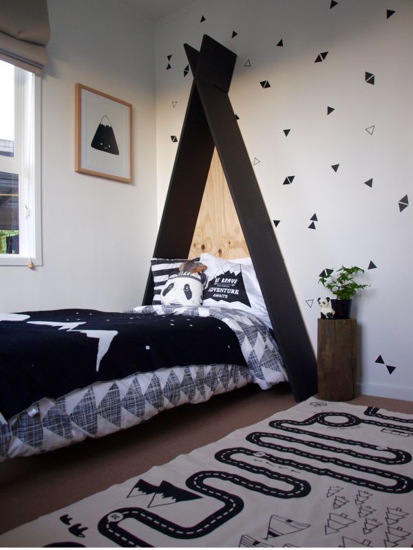 Simple bed with tent inspired headboard