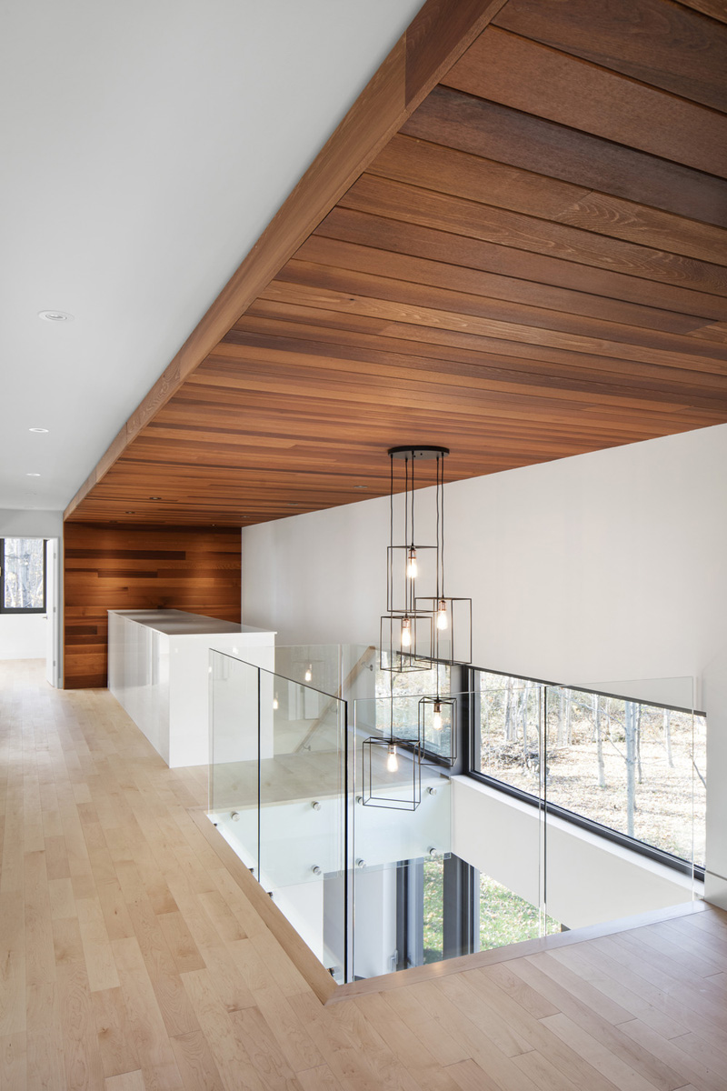 Simple forest house with cedar siding staircase