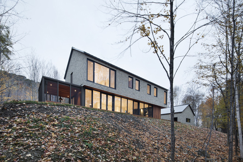 Simple forest house with cedar siding view