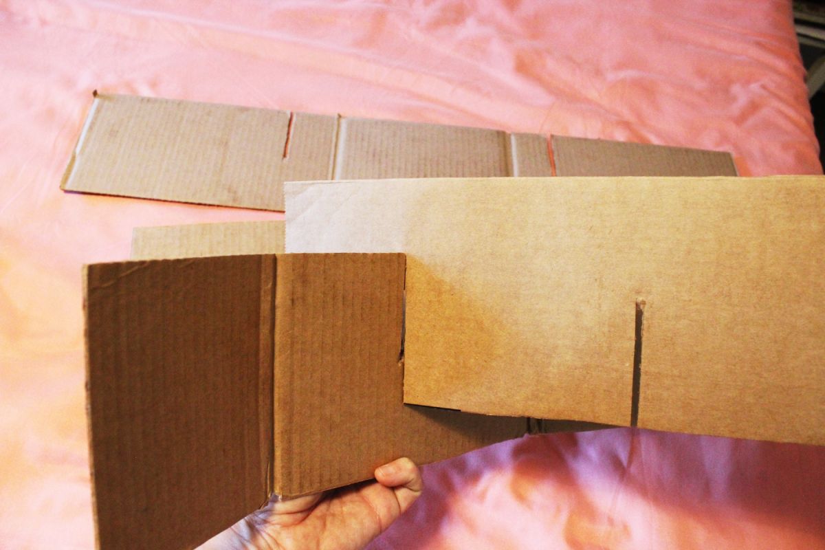 Slide the cardboard strips