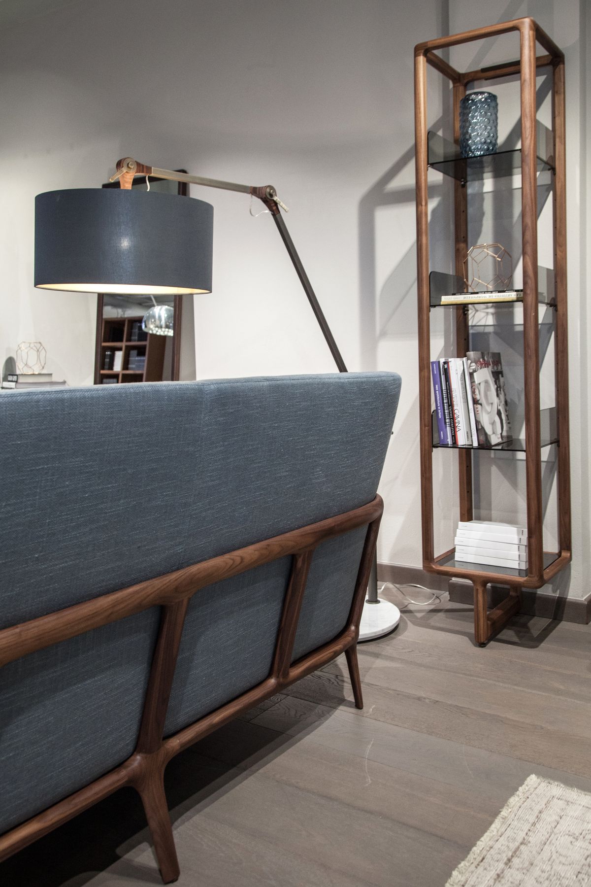 Small and narrow standing bookcase with glass shelves