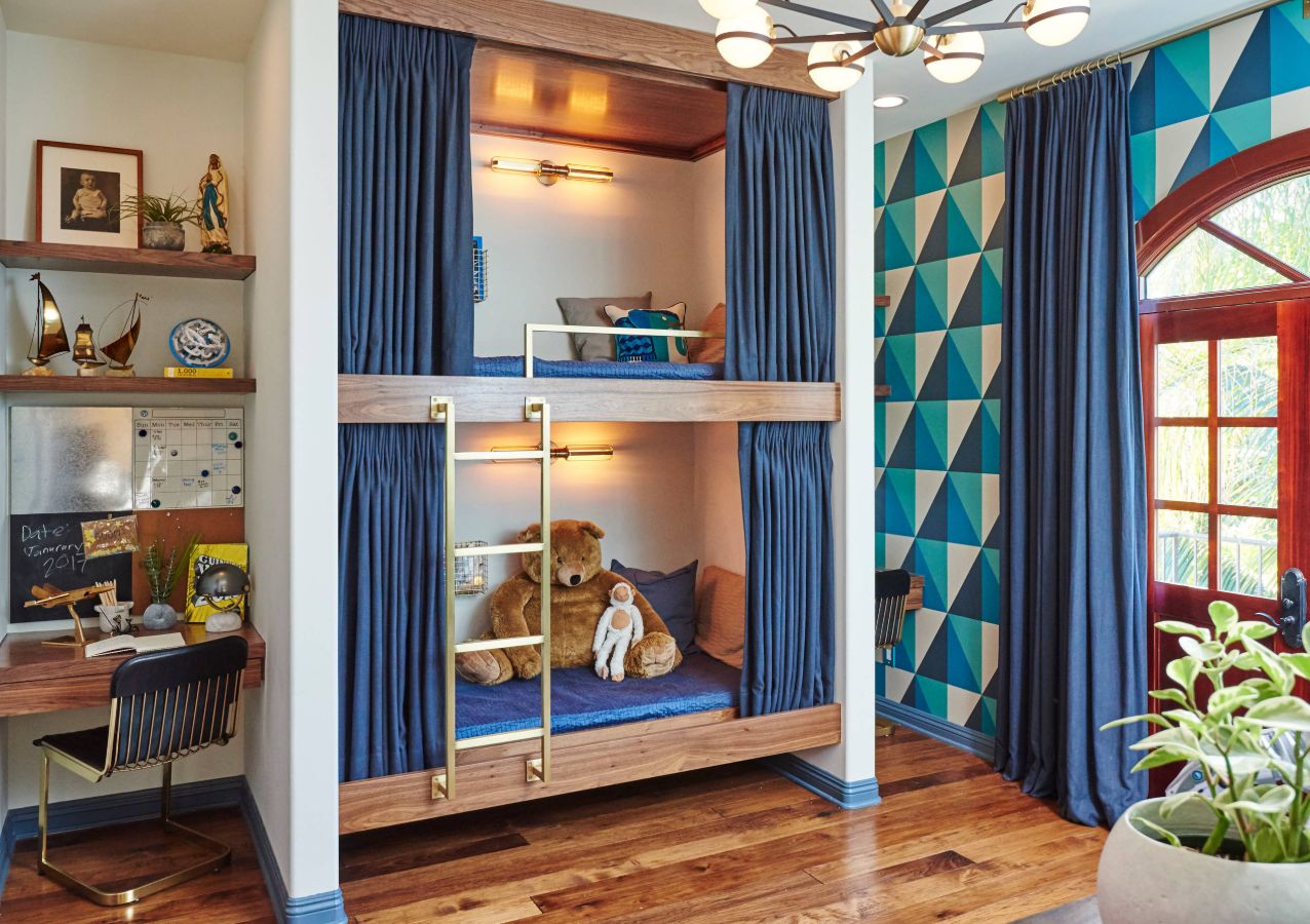 Small bunk beds with a built in layout and brass ladder