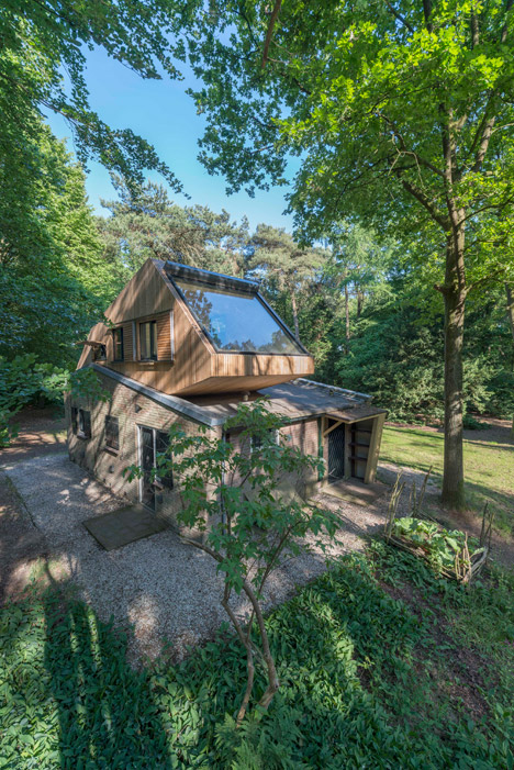 Small cabin in the woods with a rooftop extension