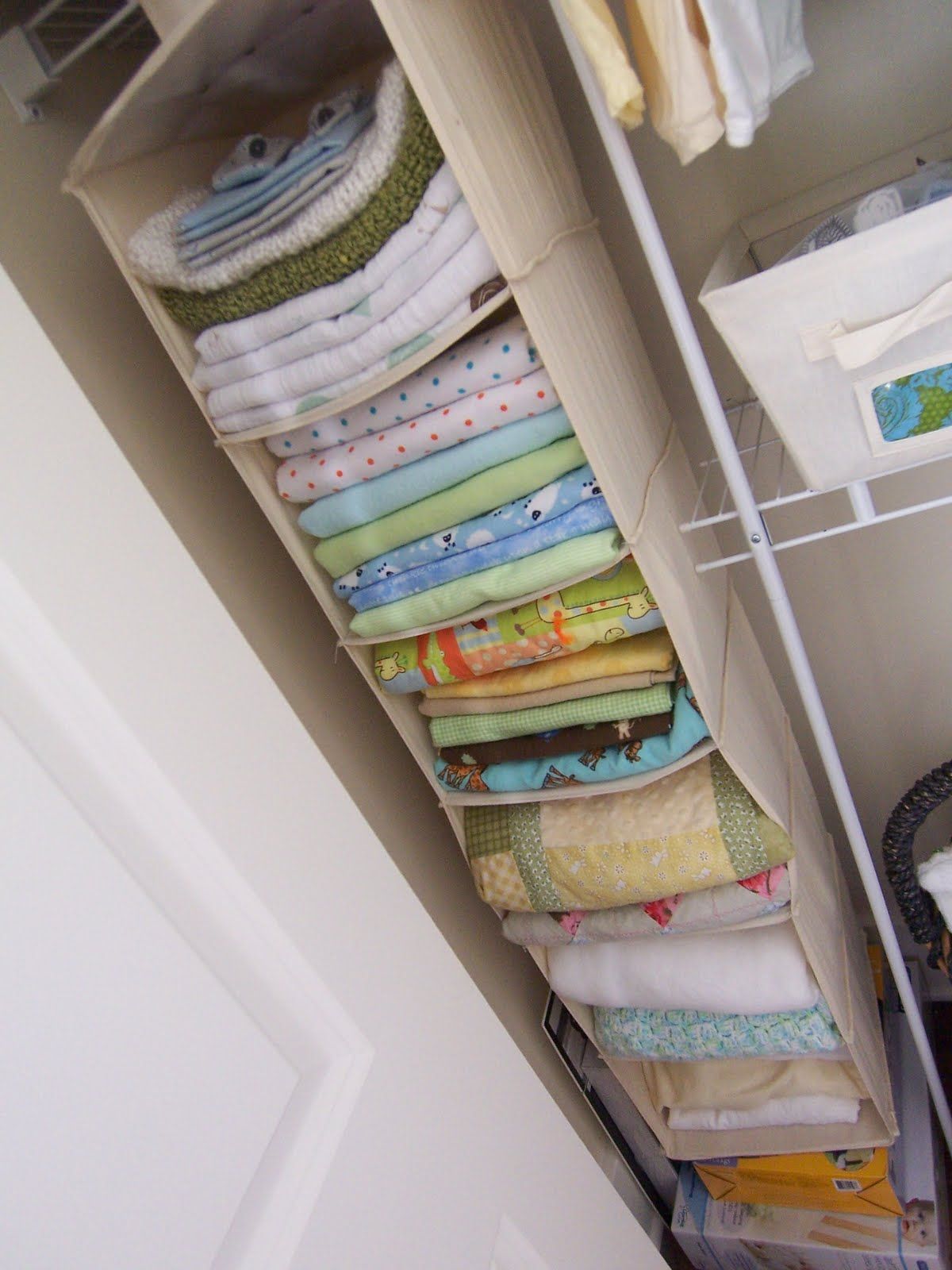 Small closet vertical storage in nursery room