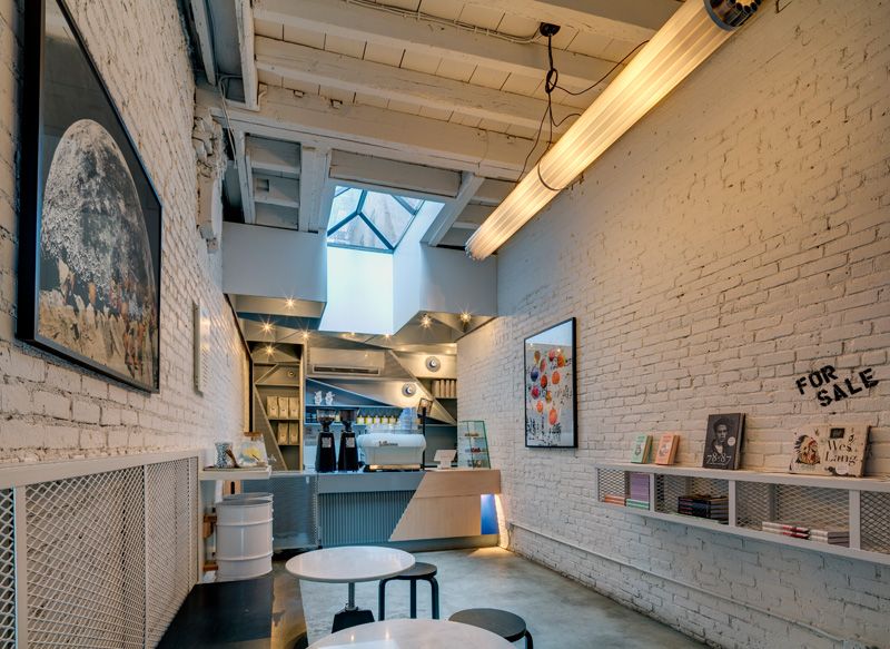 Small coffee shop in NY by Ghislaine Viñas Interior Design and UM Project - white painted bricks