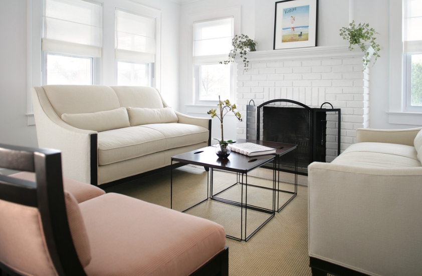 Small living room with a white brick fireplace