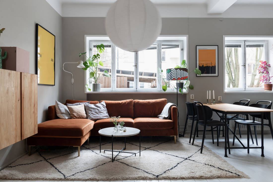 Small open floor plan with green kitchen cabinets sofa