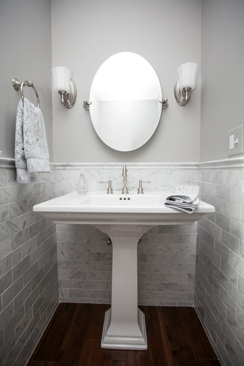 Small powder room with tile trim