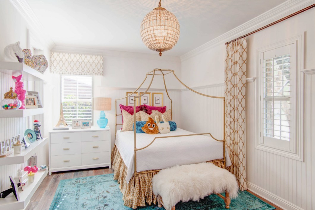 Small teenage bedroom with canopy bed and fur ottoman