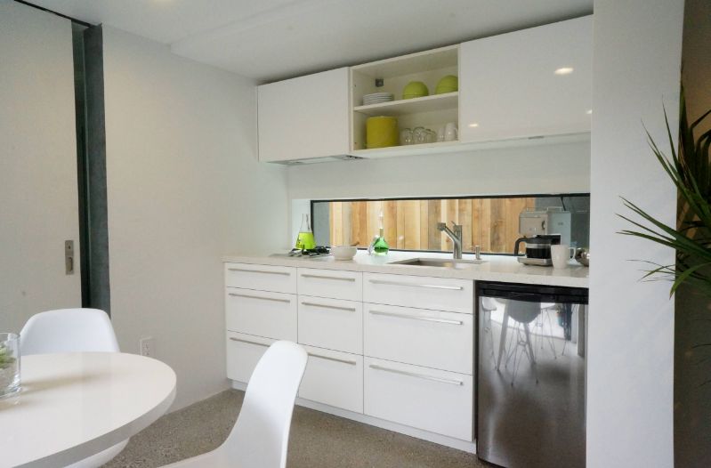 Small white kitchen with tiny windows