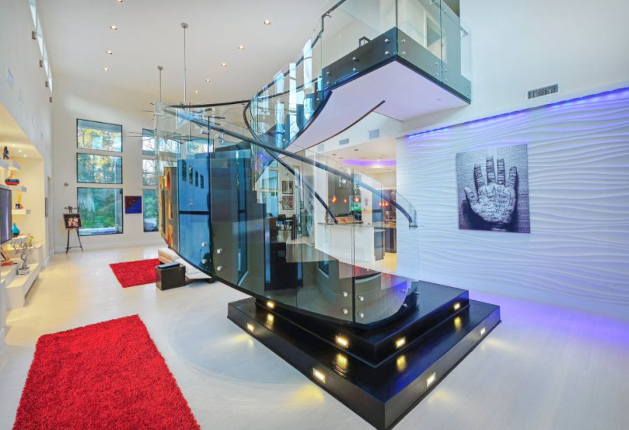 Spiral staircase with glass railings and lights