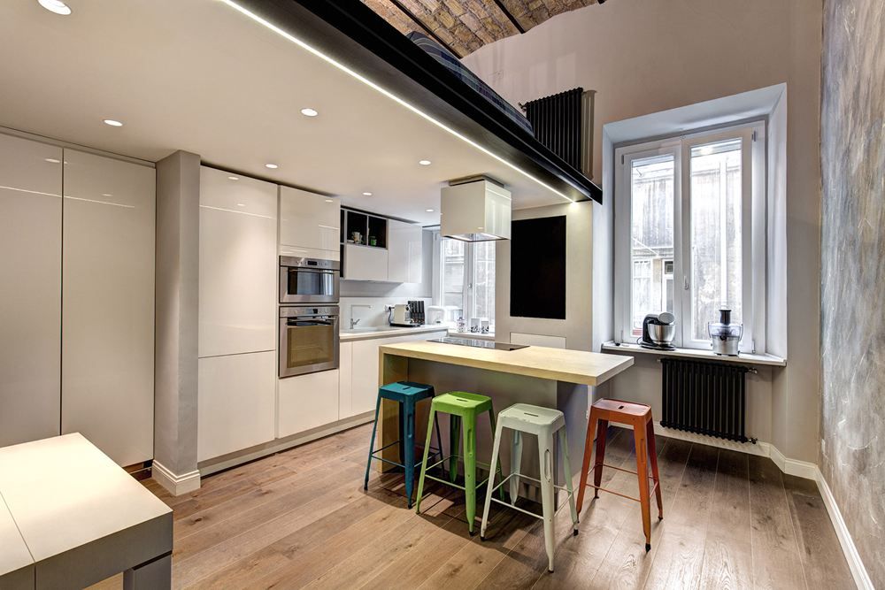Splash of color in kitchen through tolix chairs