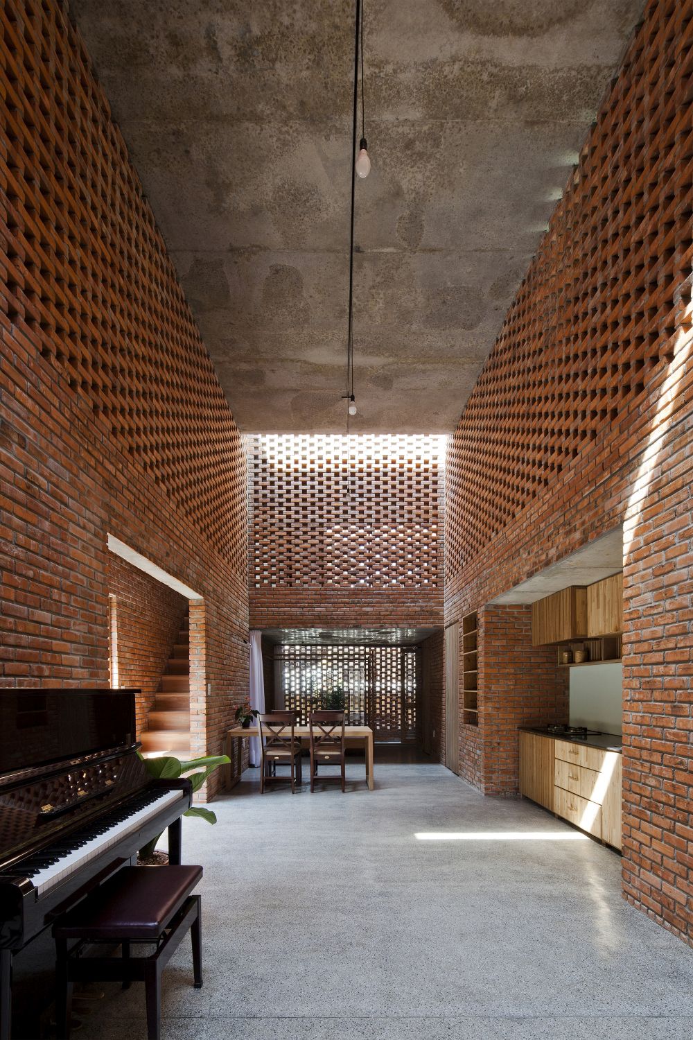 Stacked perforated bricks - Termitary House - hallway