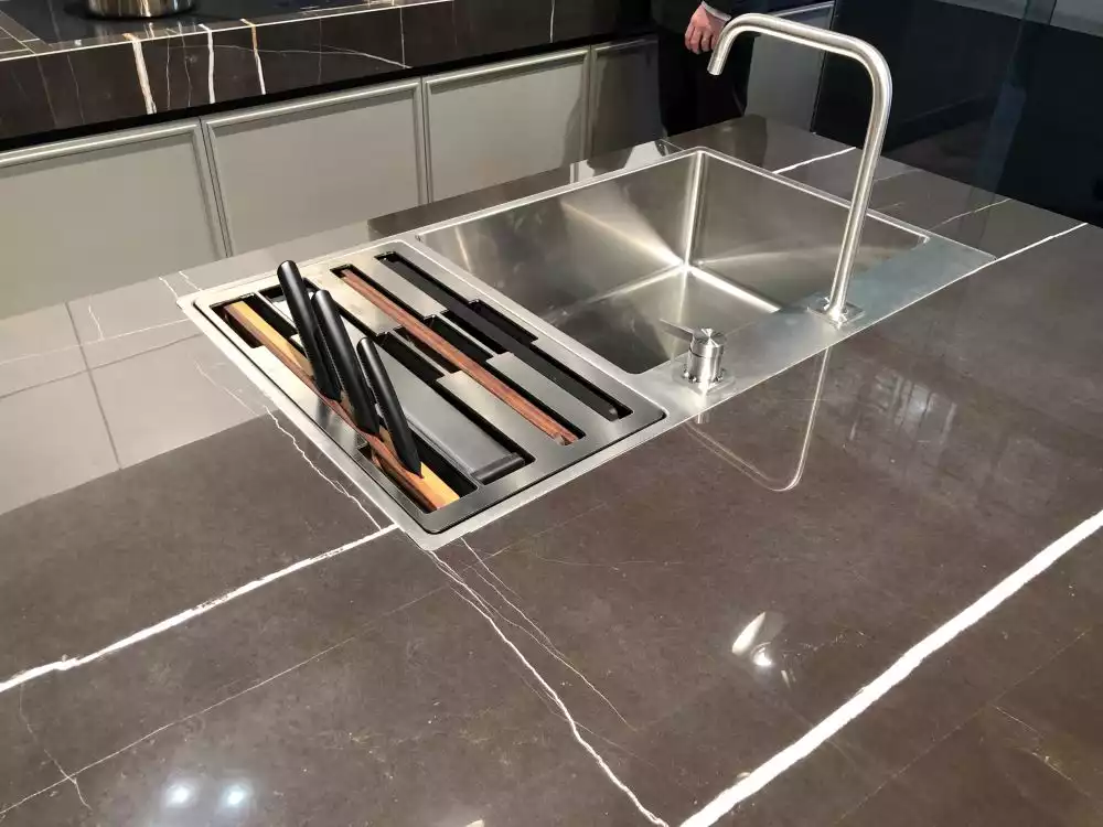 Stainless steel kitchen sink and countertop storage