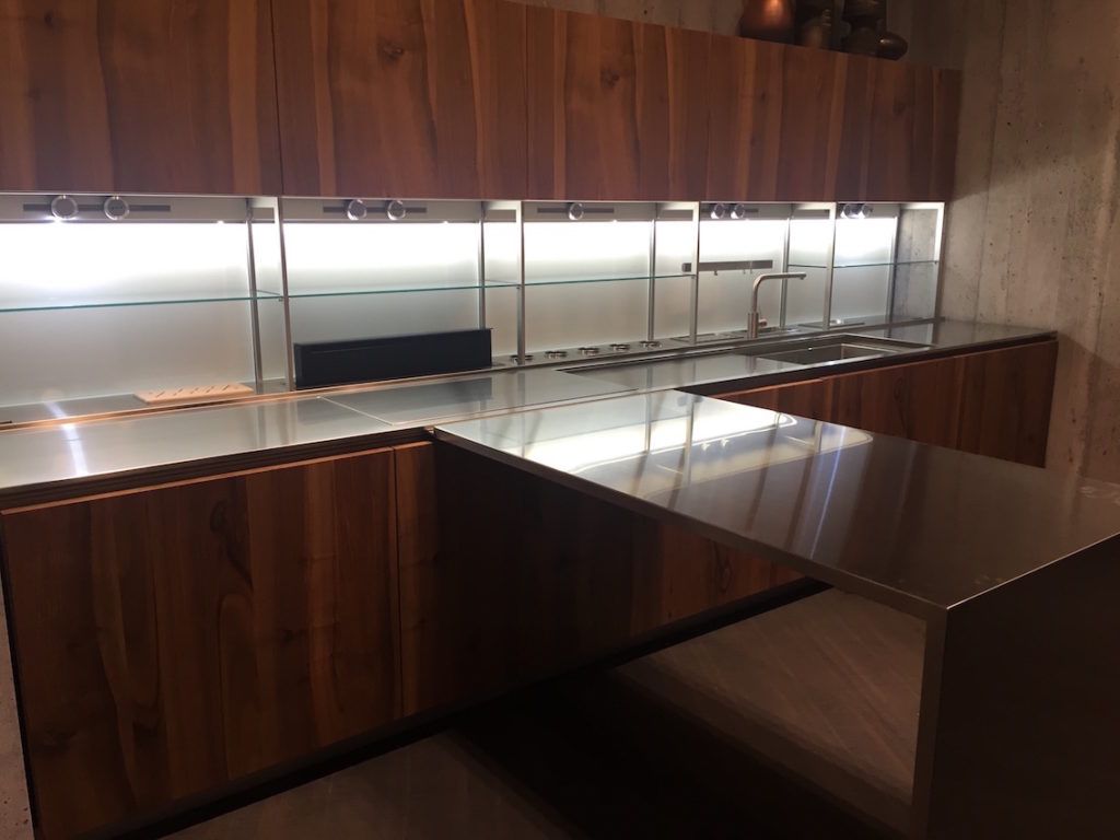 Stainless steel with sleek wood for a minimalist kitchen