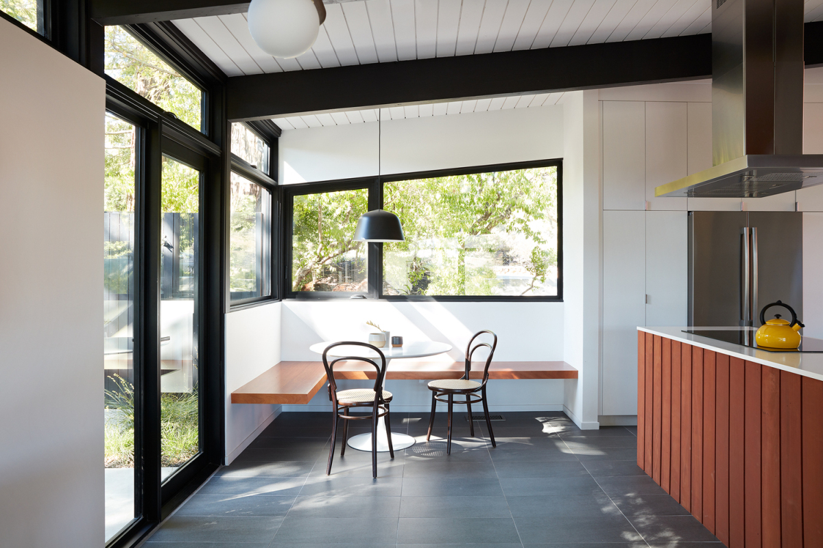 The kitchen was opened up and expanded to also include a breakfast nook in the corner