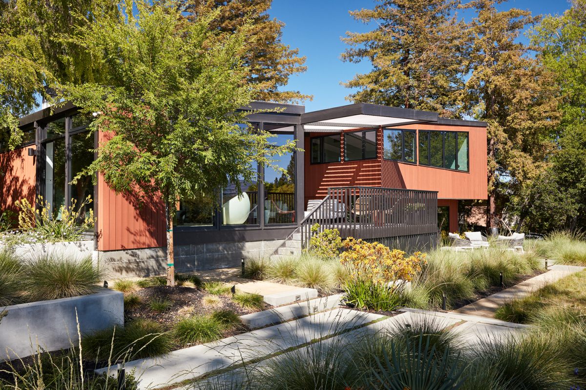 A new deck acts as an extension of the living room and a new pergola was also added