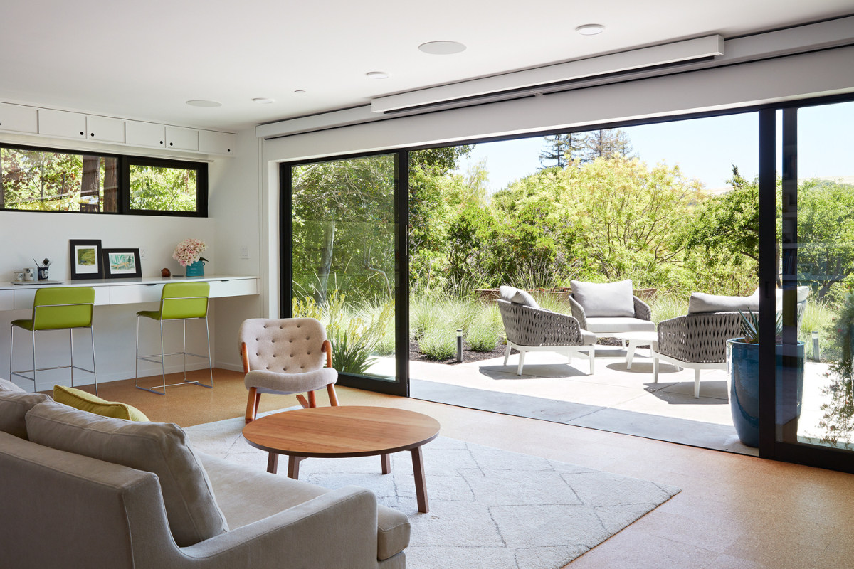 The new home office enjoys a seamless connection with the outdoors as well