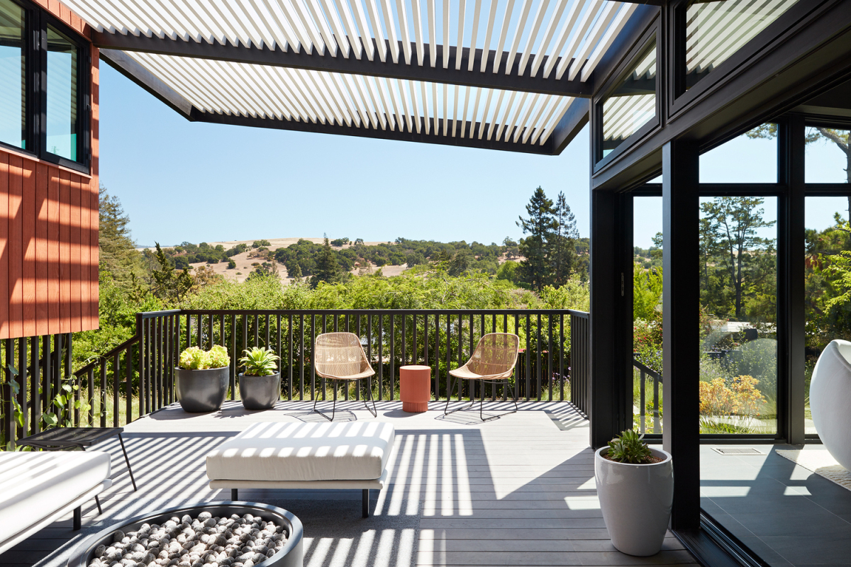 The pergola deck adjacent to the living room offers a beautiful and expansive view