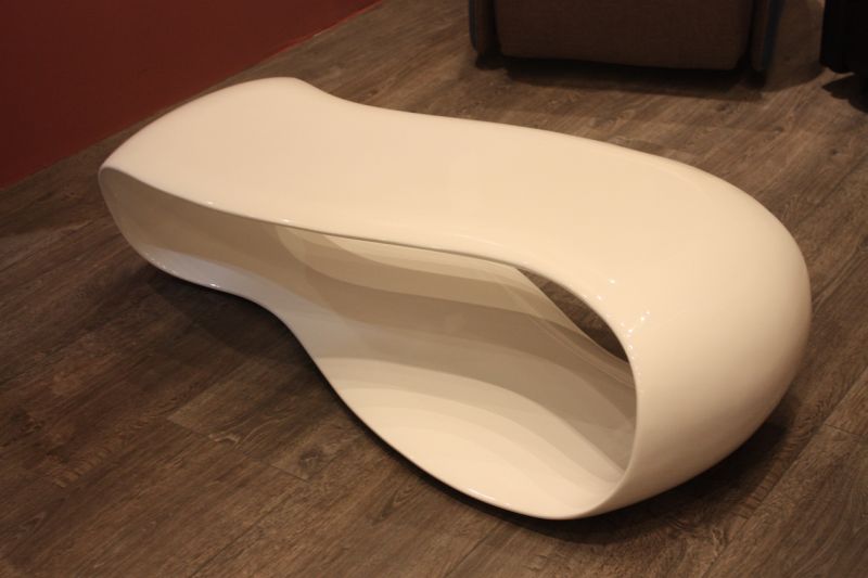 This continuous curved coffee table from Stones is smooth and elegant -- perfect for a living room where the style is a bit more formal.