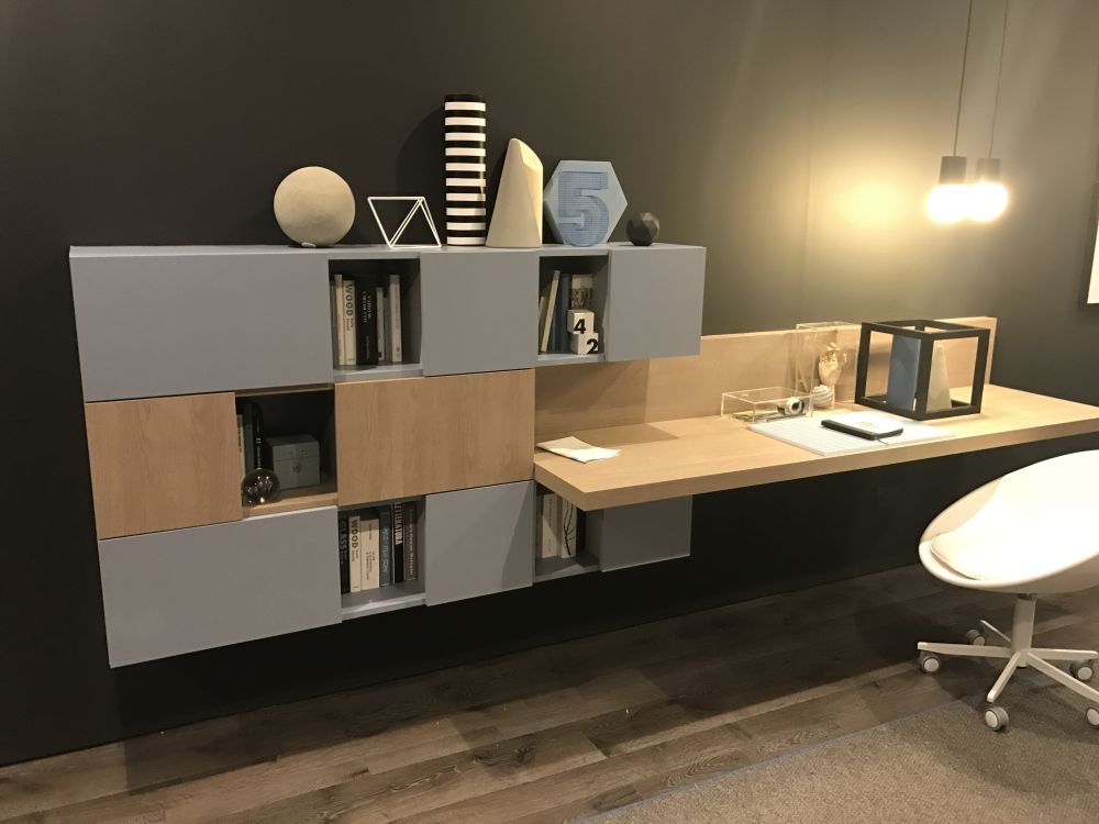 This desk looks like an extension of a wall-mounted storage module