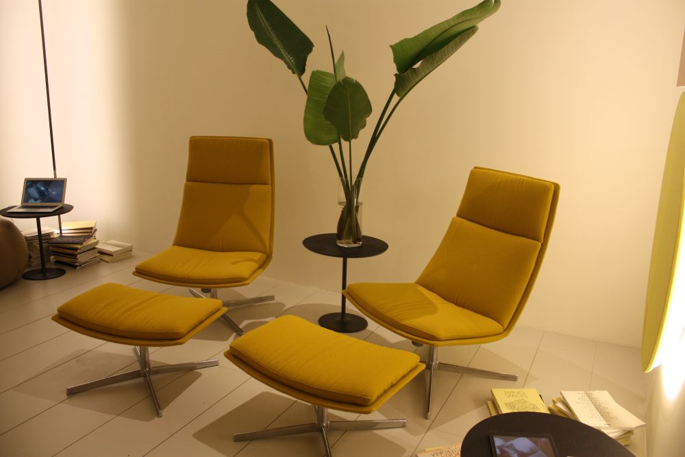 Swivel yellow chairs with ottomn