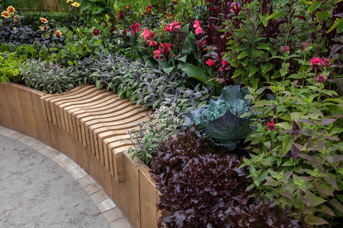 Surround the bench with flowering plants for fragrance or plant trees for shade