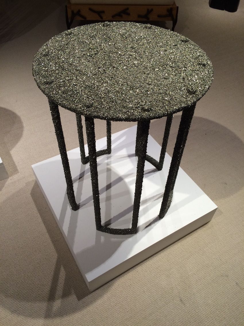 Crush pyrite adorns this small table as well, creating a glittering piece that would work in a casual or formal environment.