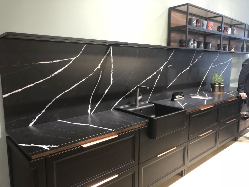 The beauty of black kitchen with marble featuring white vines