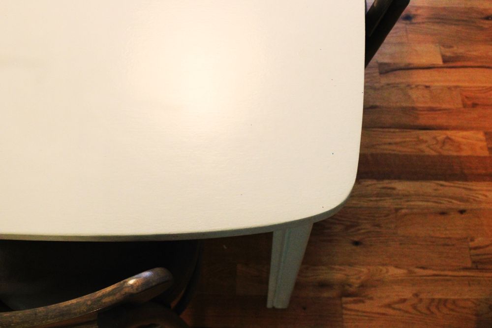 The dining table is neither oval nor rectangular