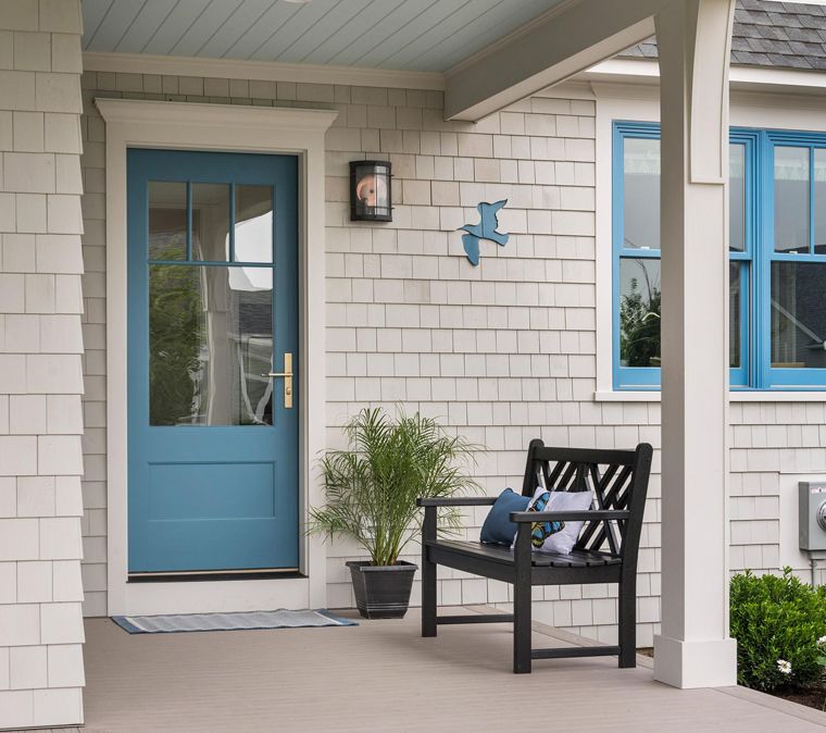 This old classic shingle-style home - entryway painted front door