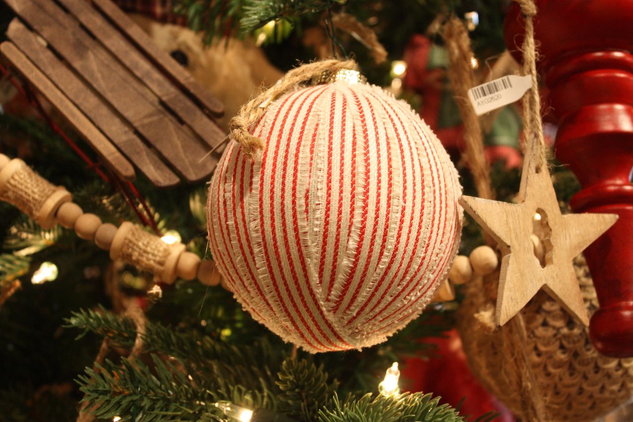 A natural fabric and frayed edges lend this ribbon-covered ball a homey look.