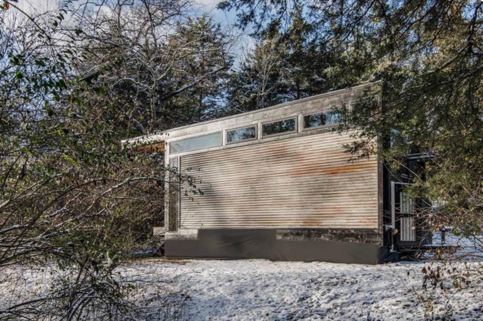 Tiny House With Corrugated Metal Siding back view