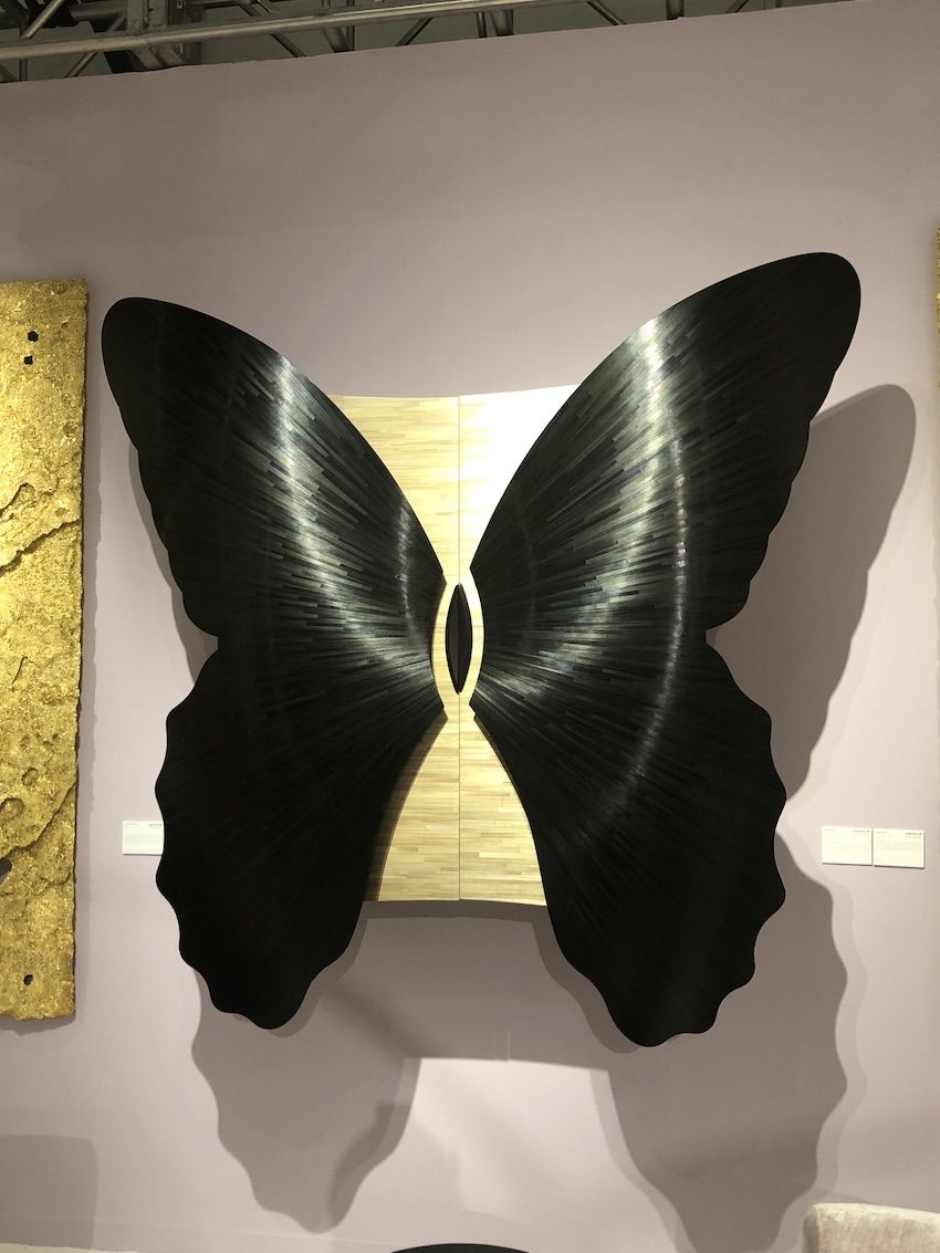 The silky dark marquetry of the wings adds an air of mystery.