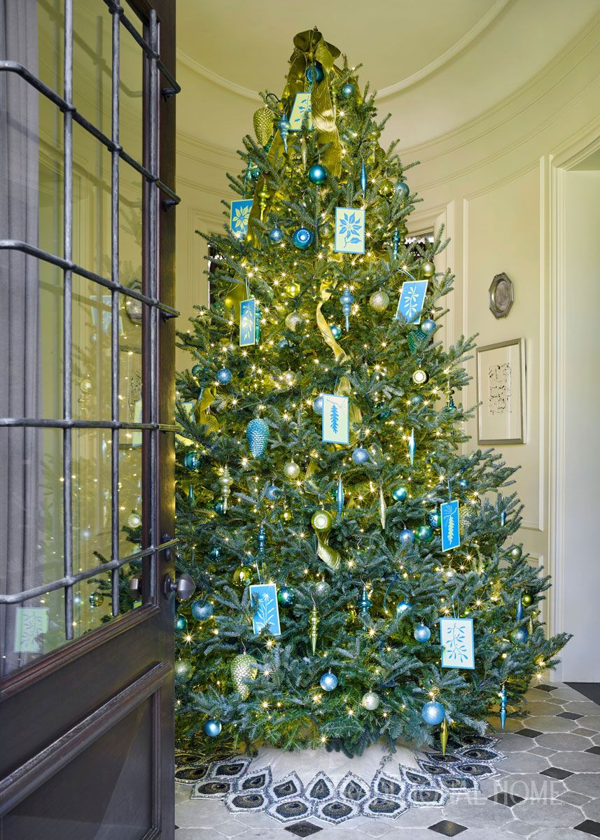 Traditional home with large entryway tree and blue accents