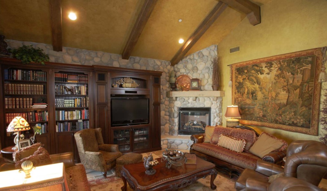 Traditional living room with corner rocks fireplace