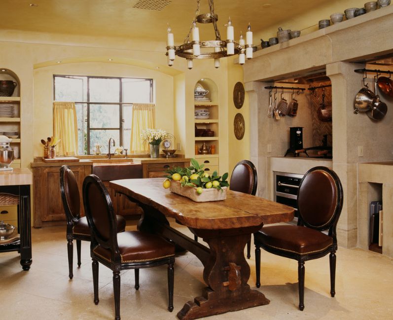 Traditional solid wood trestle dining table and leather chairs