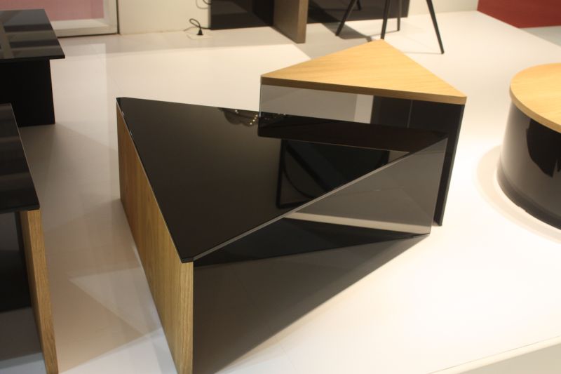 A similar design is their triangular coffee table set, that includes pieces of various heights.