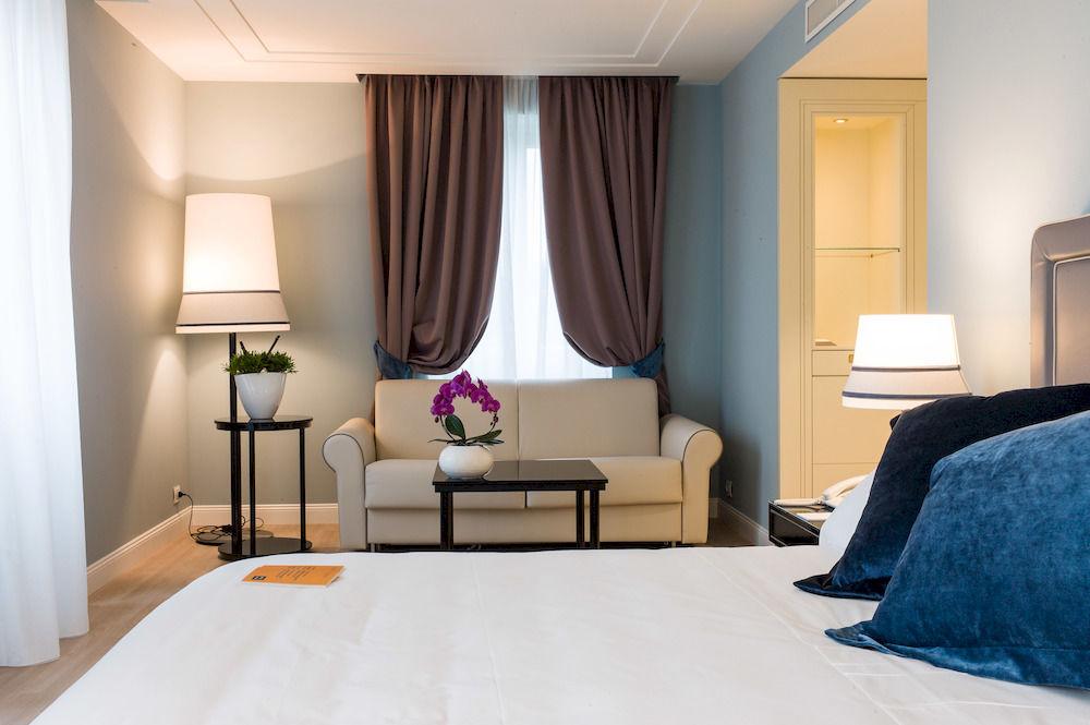 Turin Palace Hotel – Turin Italy room design with large curtains