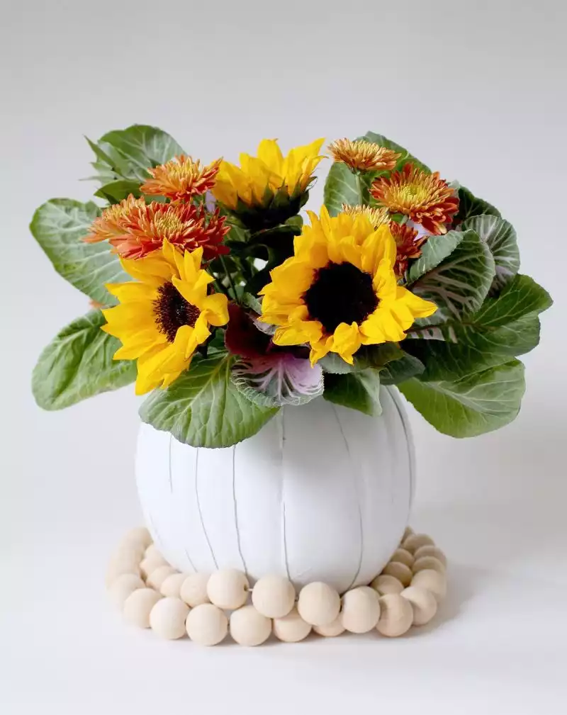 Turning a pumpkin into a flower vase