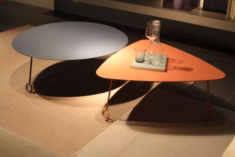 For a truly retro look, we'd try one of thees tables from TWILS. The shapes are modern, the colors great, and the eye-pin legs are just plain fantastic. They are plenty large but the legs and thin top keep them light.