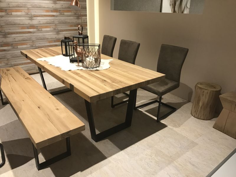 Unfinished wood table and bench with black frame