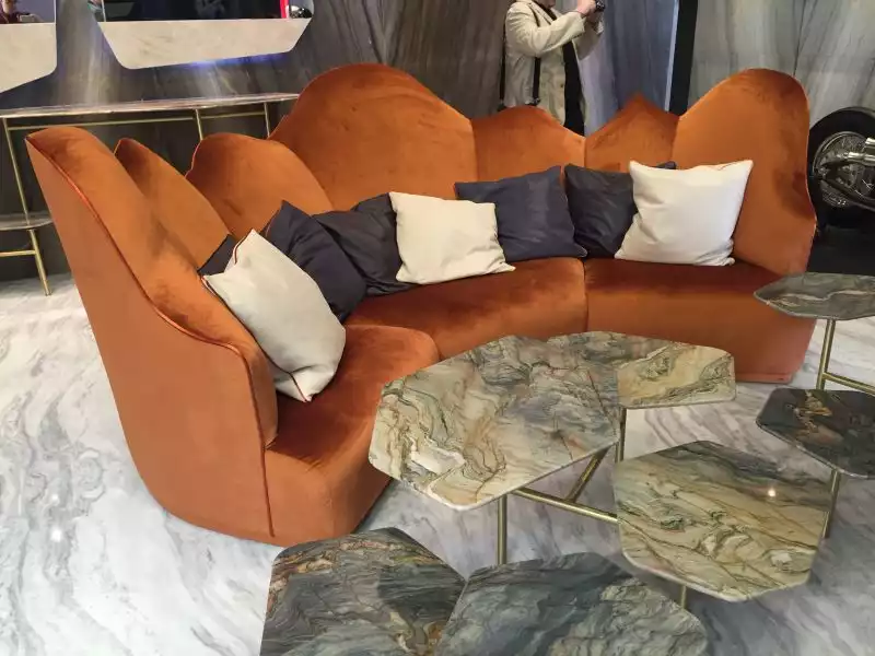 unique-curved-sofa-decorated-with-throw-pillows