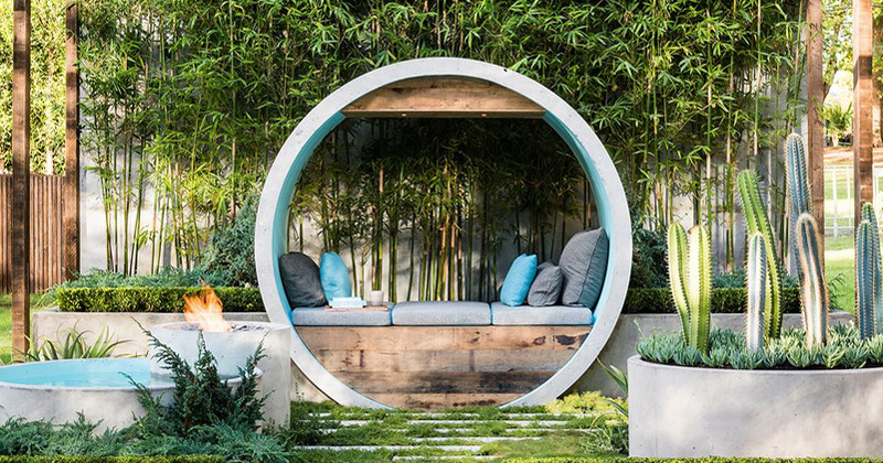 Urban garden with concrete pipes for seating