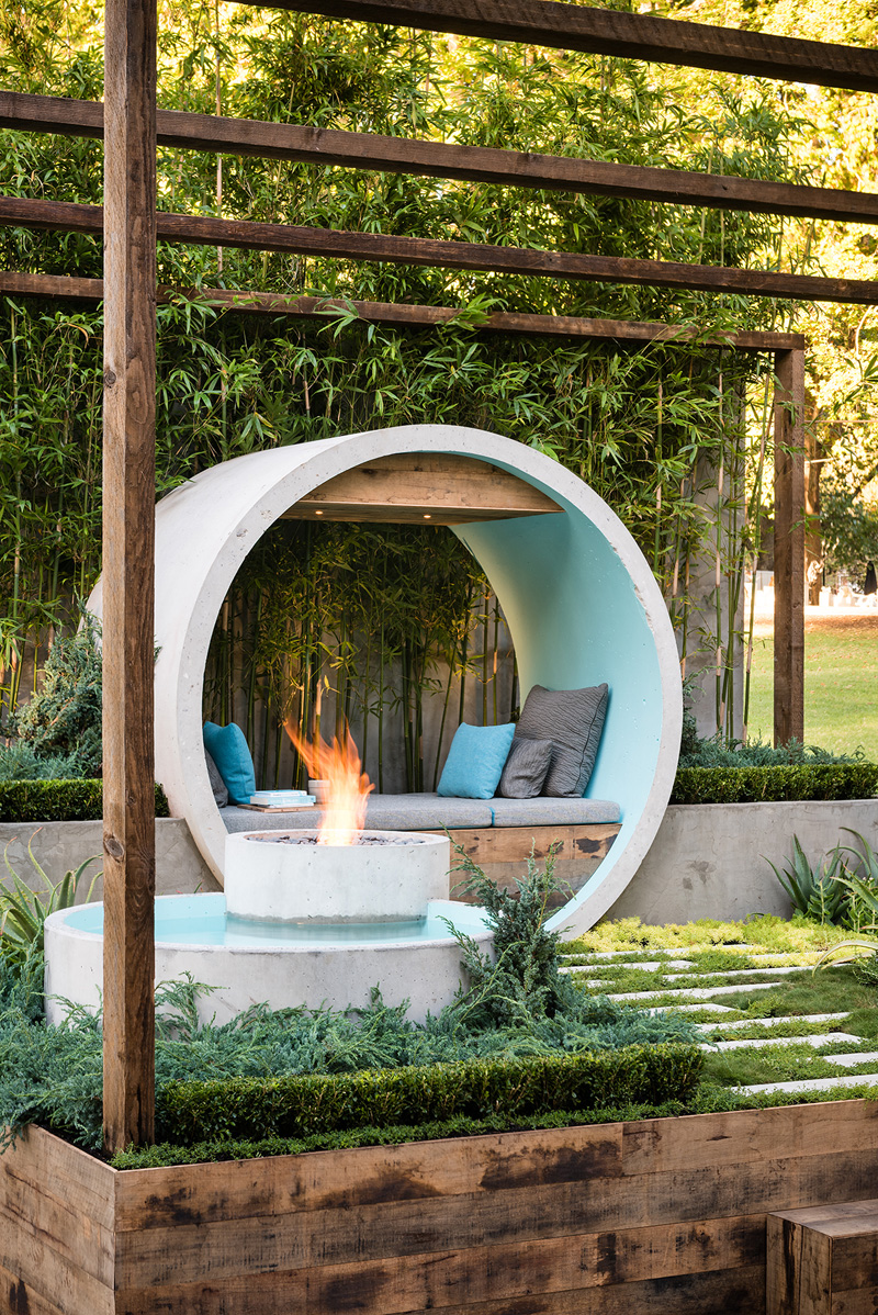 Urban garden with concrete pipes for water features